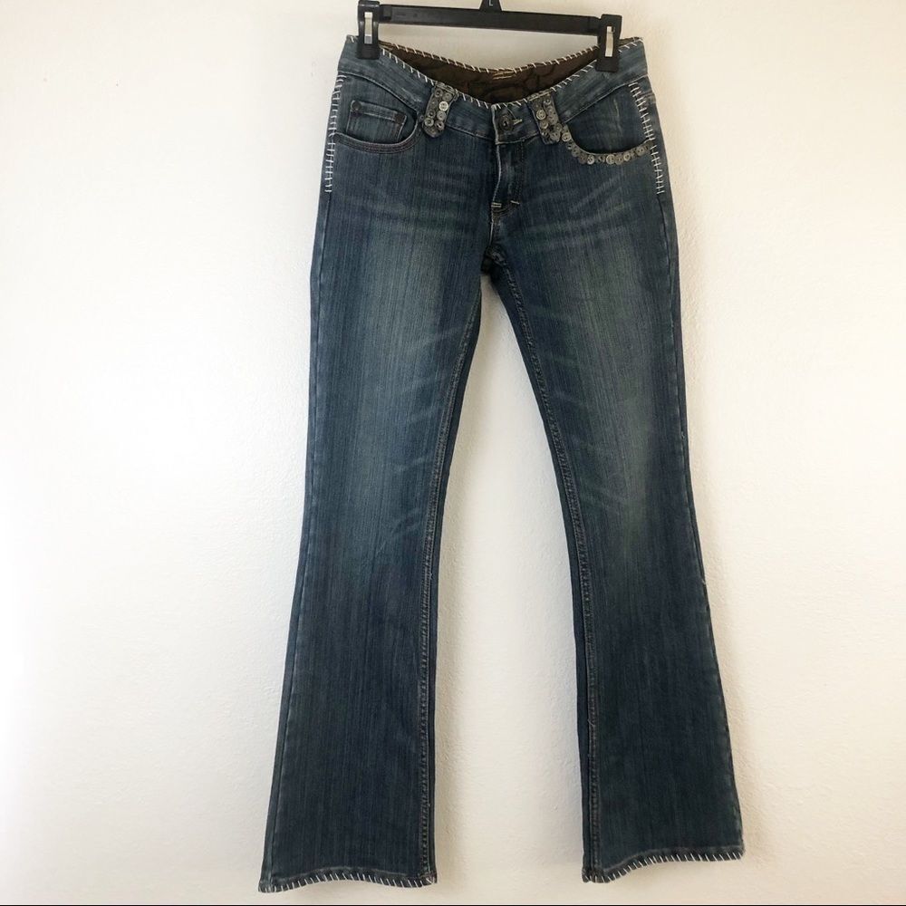 Do Denim Blue Jeans with metal buttons  detail around pockets size 27